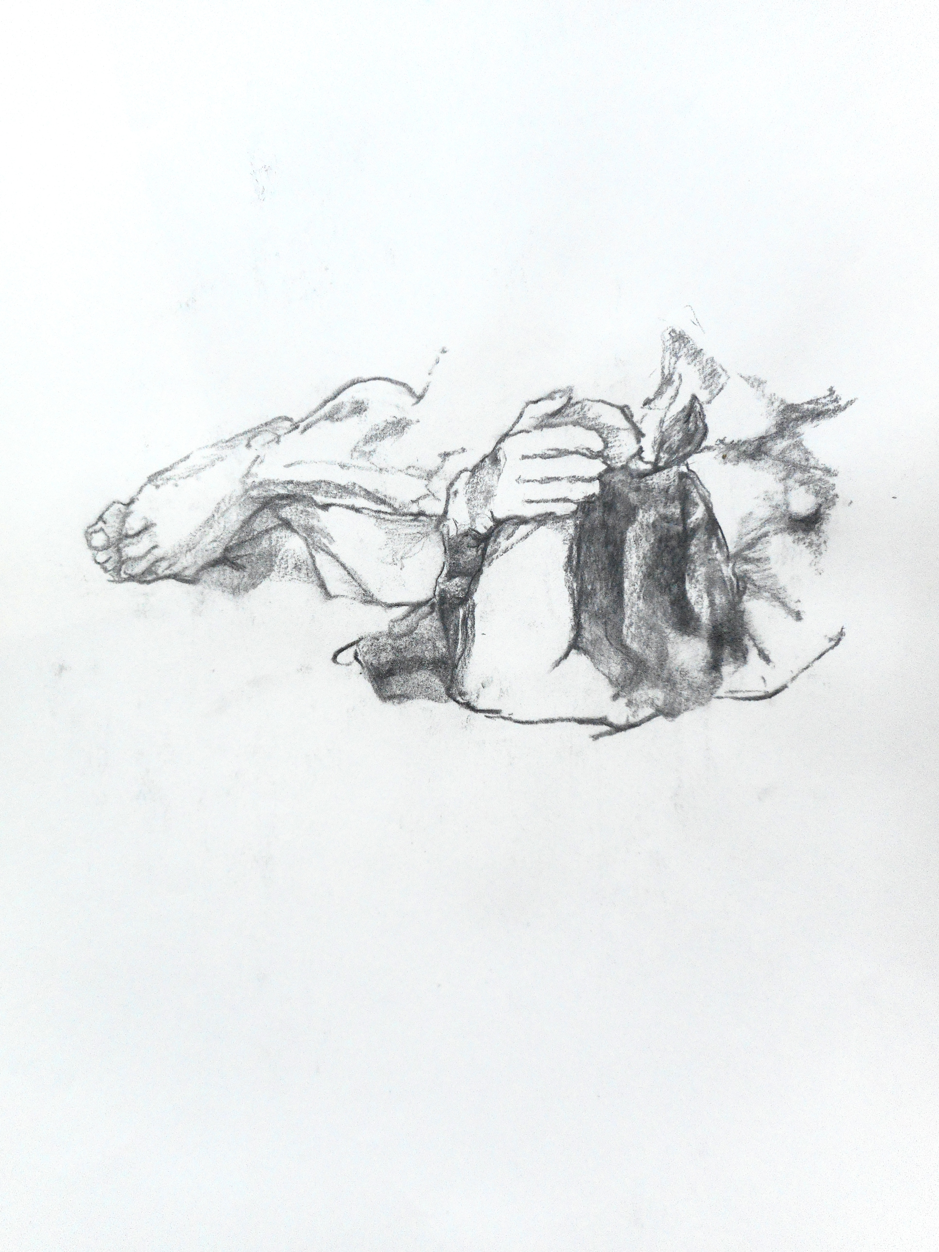 A woman lying curled up on herself.