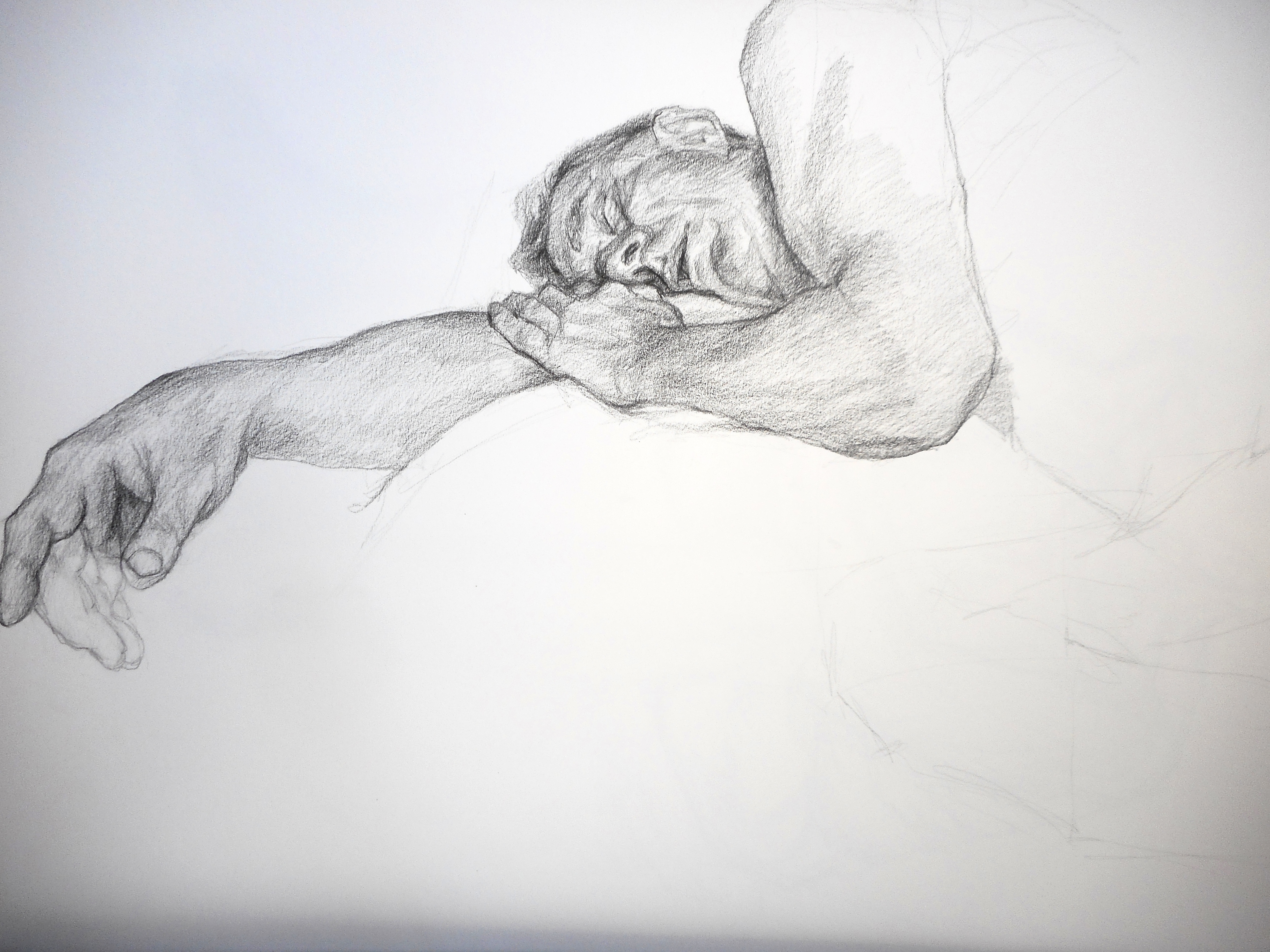 An old man asleep on his arm.