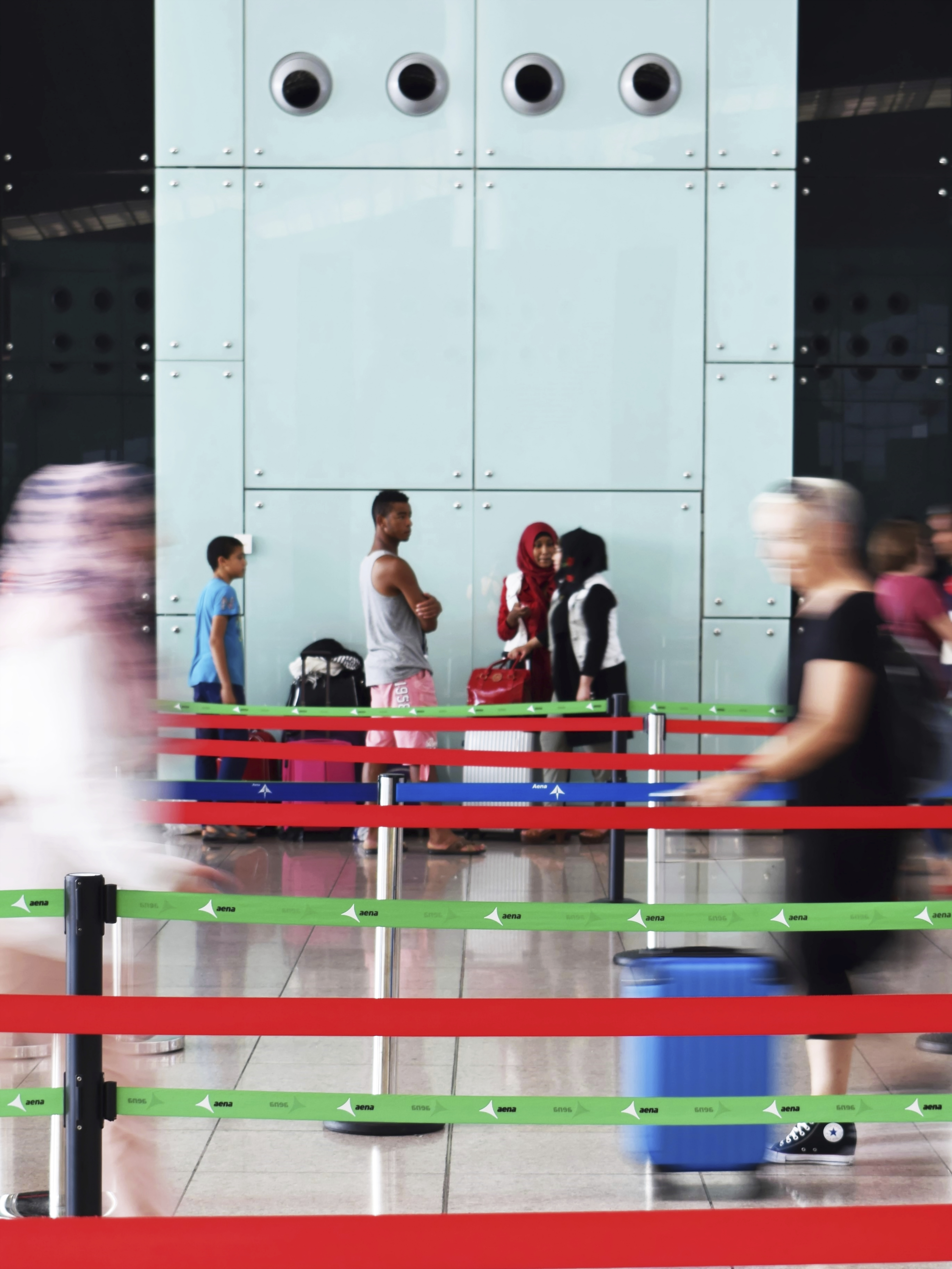 Passengers passing and queuing at the airport