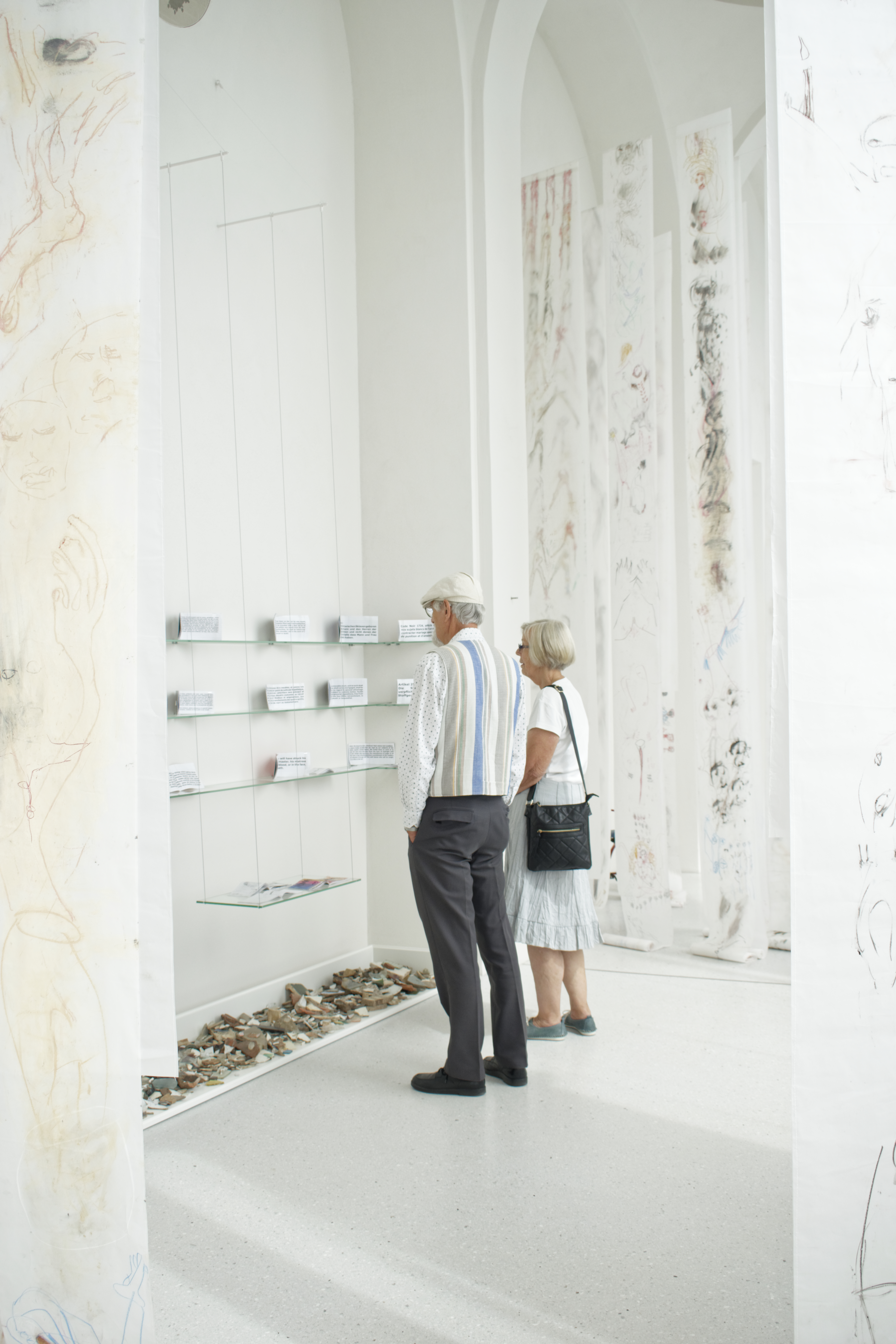An elderly couple visiting an exhibition at the museum